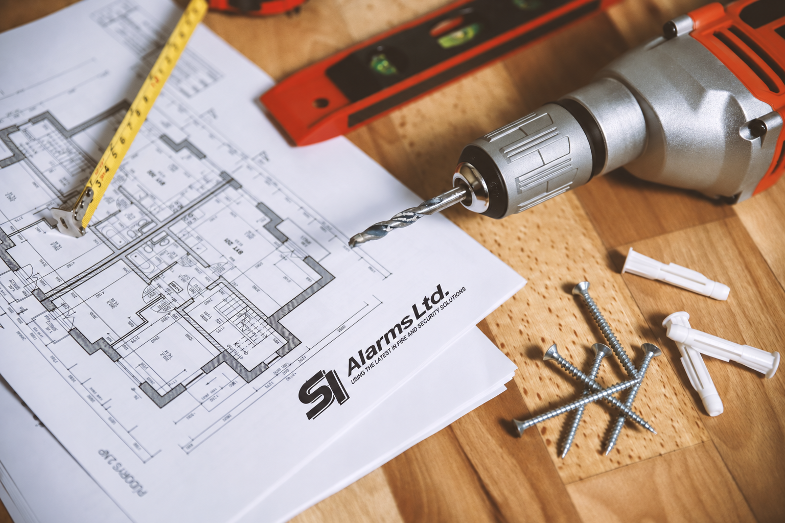 Floor plan and drafting tools on a work table